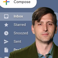 Dark-haired man in front of a screengrab of an email inbox